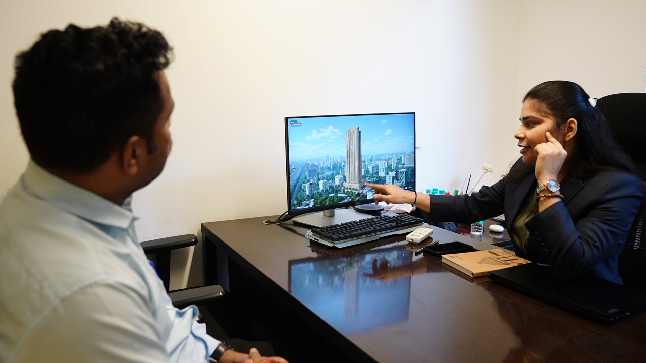 Buyer consultation with tower visualization on real estate sales screen