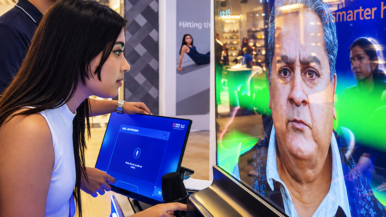 Visitor interacting with the Manoj Pahwa AI avatar at the HDFC Securities scam awareness activation