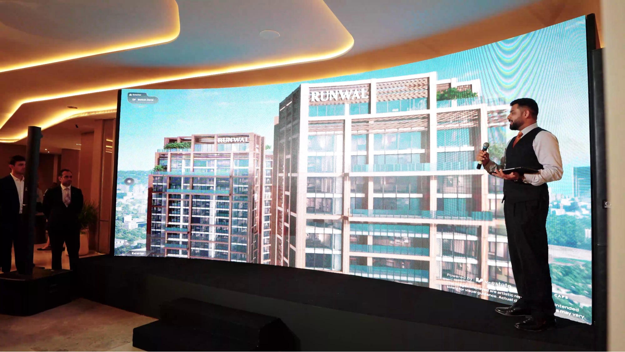Sales executive presenting a digital floor plan to buyers